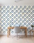 Gilt Scatter Navy floral scatter wallpaper behind a modern oak desk in a bright home office