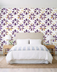 Gilt Scatter Plum floral scatter wallpaper behind a queen bed in a bright coastal bedroom