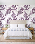 Harbor Fern Plum fern wallpaper behind a queen bed in a bright coastal bedroom