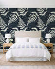 Harbor Fern Slate fern wallpaper behind a queen bed in a bright coastal bedroom