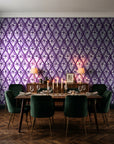 Hidden Court Plum floral ogee wallpaper in a dark moody dining room with a candlelit table