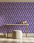 Hidden Court Plum floral ogee wallpaper on the wall of a grand entry foyer