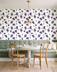 Hidden Garden Aubergine floral wallpaper as a feature wall in a sunlit breakfast nook