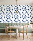 Hidden Garden Navy floral wallpaper as a feature wall in a sunlit breakfast nook