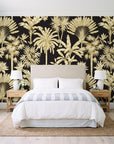 Hush & Palm Ebony palm trees wallpaper behind a queen bed in a bright coastal bedroom