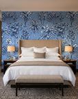 Hush & Palm Midnight palm trees wallpaper behind the headboard of a king bed in a contemporary hotel guest room