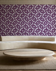 Indigo Labyrinth Plum geometric wallpaper in an elegant living room