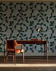 Ink & Oak Evergreen oak leaf and berry wallpaper as a feature wall in a home study