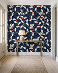 Ink & Oak Midnight oak leaf and berry wallpaper behind a console table in a light entry hallway
