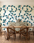 Ink & Oak Teal oak leaf and berry wallpaper in a farmhouse dining room with a sage sideboard and rustic trestle table