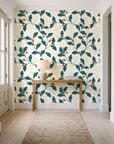Ink & Oak Teal oak leaf and berry wallpaper behind a console table in a light entry hallway