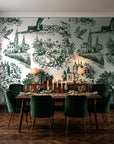 Inked Grove Forest pastoral toile wallpaper in a dark moody dining room with a candlelit table