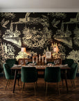 Inked Grove Gilt pastoral toile wallpaper in a dark moody dining room with a candlelit table