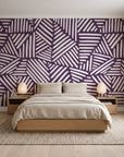 Kinetic Etch Plum hand-drawn lines wallpaper behind a low platform bed in a serene Japandi bedroom