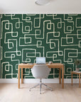 Linear Circuit Emerald minimalist line wallpaper behind a modern oak desk in a bright home office
