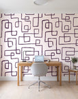 Linear Circuit Plum minimalist line wallpaper behind a modern oak desk in a bright home office