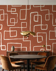 Linear Circuit Terracotta minimalist line wallpaper behind a walnut credenza and round table in an elegant dining room