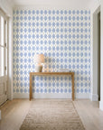 Linen Diamonds Navy argyle wallpaper behind a console table in a light entry hallway