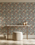 Magnolia Morning Terracotta magnolia bloom wallpaper on the wall of a grand entry foyer