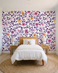 Matisse Reverie Plum folk floral wallpaper in a bright, cheerful child's bedroom
