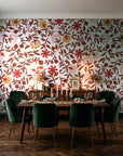 Matisse Reverie Rust folk floral wallpaper in a dark moody dining room with a candlelit table