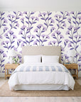 Meadow Light Lavender meadow flower wallpaper behind a queen bed in a bright coastal bedroom