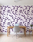 Mistletoe Trail Aubergine mistletoe wallpaper behind a modern oak desk in a bright home office