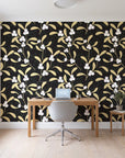 Mistletoe Trail Noir mistletoe wallpaper behind a modern oak desk in a bright home office