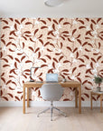 Mistletoe Trail Terracotta mistletoe wallpaper behind a modern oak desk in a bright home office