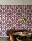 Misty Fern Romance Oxblood damask wallpaper in an elegant dining room