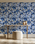 Muted Block Indigo geometric wallpaper on the wall of a grand entry foyer