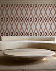 Ogee Loom Terracotta ikat ogee wallpaper in an elegant living room