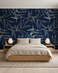 Pale Foliage Midnight willow leaf wallpaper behind a low platform bed in a serene Japandi bedroom