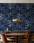 Pale Foliage Midnight willow leaf wallpaper behind a walnut credenza and round table in an elegant dining room