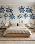 Palm Shade Navy palm grove wallpaper behind a low platform bed in a serene Japandi bedroom