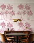 Palm Shade Rose palm grove wallpaper behind a walnut credenza and round table in an elegant dining room