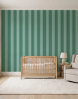 Parlor Stripe Emerald geometric stripe wallpaper in a calm, light-filled nursery