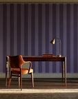 Parlor Stripe Plum geometric stripe wallpaper as a feature wall in a home study