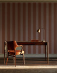 Parlor Stripe Terracotta geometric stripe wallpaper as a feature wall in a home study