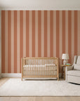 Parlor Stripe Terracotta geometric stripe wallpaper in a calm, light-filled nursery