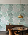 Petal Cascade Emerald spiral rosette wallpaper in an elegant dining room