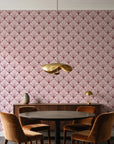Petal Dawn Oxblood art deco fan wallpaper behind a walnut credenza and round table in an elegant dining room