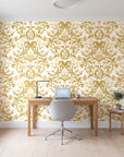 Petal Reflection Ochre floral damask wallpaper behind a modern oak desk in a bright home office