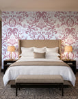 Petal Reflection Rose floral damask wallpaper behind the headboard of a king bed in a contemporary hotel guest room