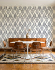 Reed & Smoke Ink geometric wallpaper in a mid-century dining room with a teak sideboard and tulip table