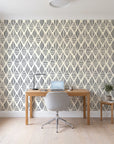 Reed & Smoke Ink geometric wallpaper behind a modern oak desk in a bright home office