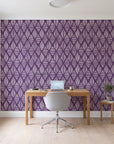 Reed & Smoke Plum geometric wallpaper behind a modern oak desk in a bright home office