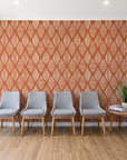 Reed & Smoke Terracotta geometric wallpaper behind a row of upholstered chairs in a bright clinic waiting room