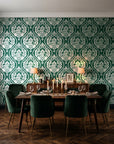 Secret Arbor Emerald damask wallpaper in a dark moody dining room with a candlelit table