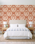 Secret Arbor Terracotta damask wallpaper behind a queen bed in a bright coastal bedroom